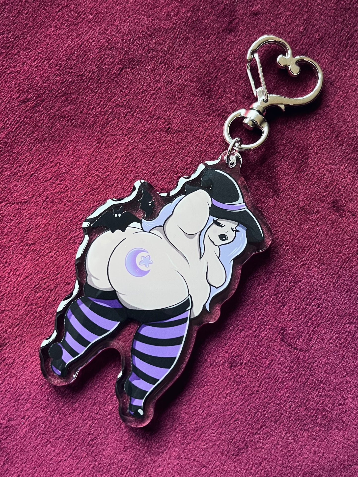 Keychain with cartoon character on a purple background